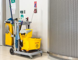 Yellow Mop Bucket And Set Of Cleaning Equipment